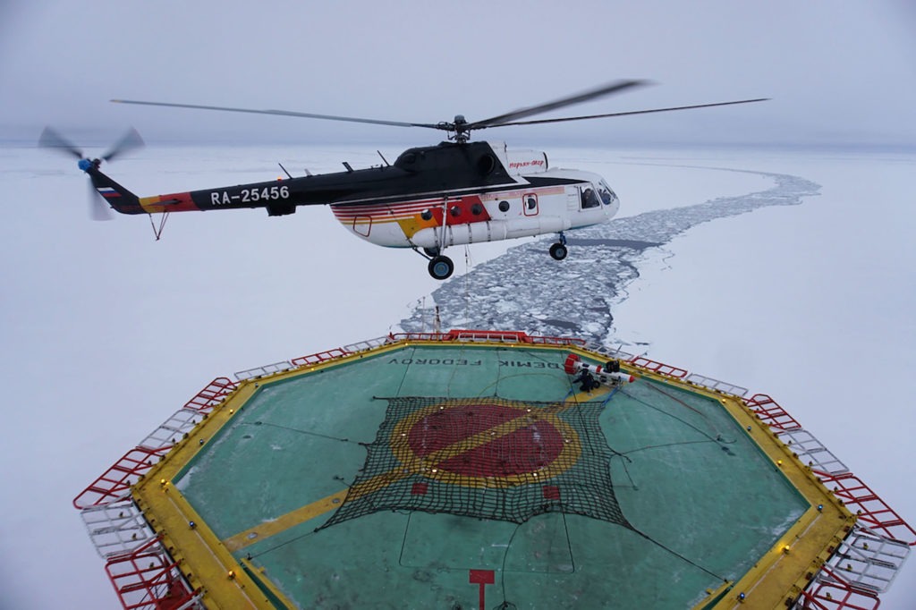 A helicopter takes off from the research vessel Akademik Federov to survey the thickness of an ice floe on Sept. 30. CREDIT: Ravenna Koenig