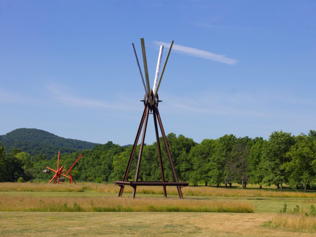 View of the south fields, all works by Mark di Suvero. Left to right: Figolu, 2005–11. Courtesy the artist and Spacetime C.C. E=MC2 , 1996-97. Courtesy the artist and Spacetime C.C. ©Mark di Suvero. Courtesy Storm King Art Center