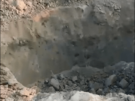 A video provided by Syria's White Helmets volunteers shows a crater where the attack took place. White Helmets/Screenshot by NPR