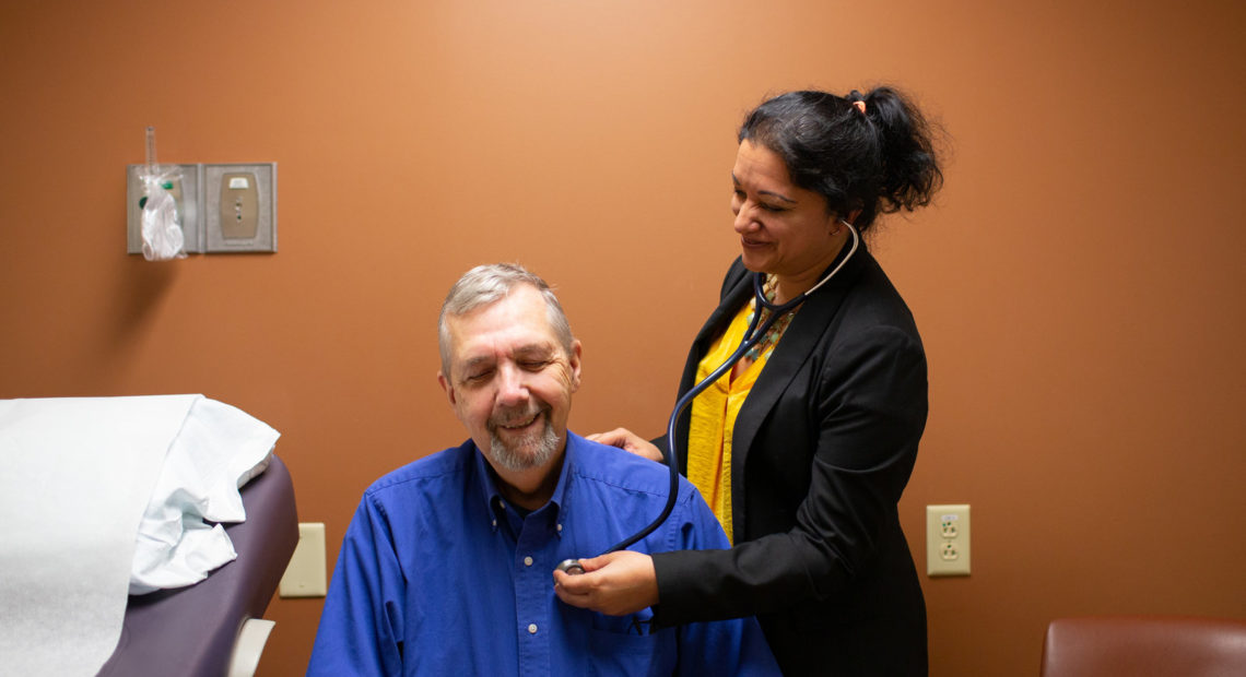 Geriatric oncologist Supriya Gupta Mohile meets with patient Jim Mulcahy at Highland Hospital in Rochester, N.Y. "If I didn't do a geriatric assessment and just looked at a patient I wouldn't have the same information," she says. CREDIT: Mike Bradley for NPR