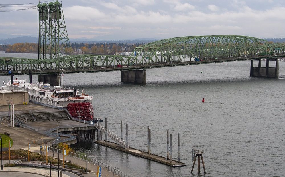 The Interstate 5 bridge is seen here from the Washington side on Monday, Nov. 18, 2019. The governors of Washington and Oregon are meeting to announce their joint plan to revive the Columbia River Crossing project. The project seeks to replace the aging Interstate 5 bridge over the Columbia River. CREDIT: Nathan Howard/The Columbian via AP