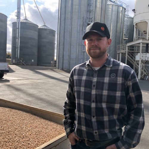 Kyle Hinrichs helps run the family business outside of Pullman, Wash. Right now the company is drying beans as fast as possible with several machines, but it’s an around the clock job. CREDIT: Anna King/N3