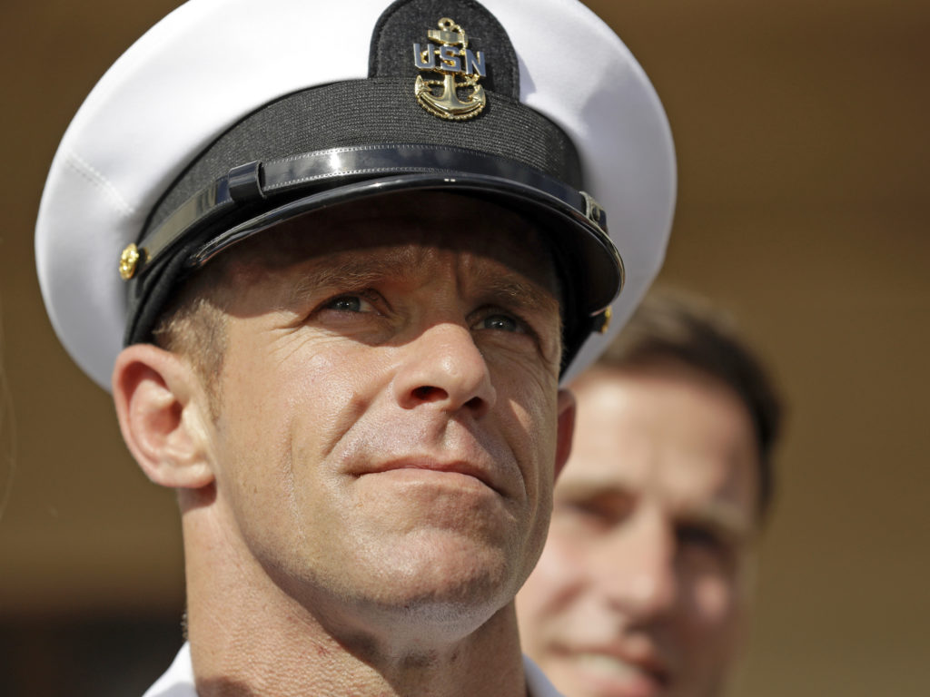 Navy Special Operations Chief Edward Gallagher leaves a military court on Naval Base San Diego in July. He was acquitted of murdering an Iraqi teen, but convicted on a lesser charge. CREDIT: Gregory Bull/AP