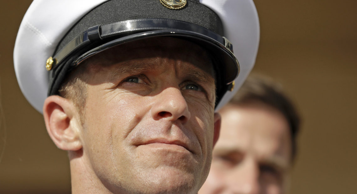 Navy Special Operations Chief Edward Gallagher leaves a military court on Naval Base San Diego in July. He was acquitted of murdering an Iraqi teen, but convicted on a lesser charge. CREDIT: Gregory Bull/AP