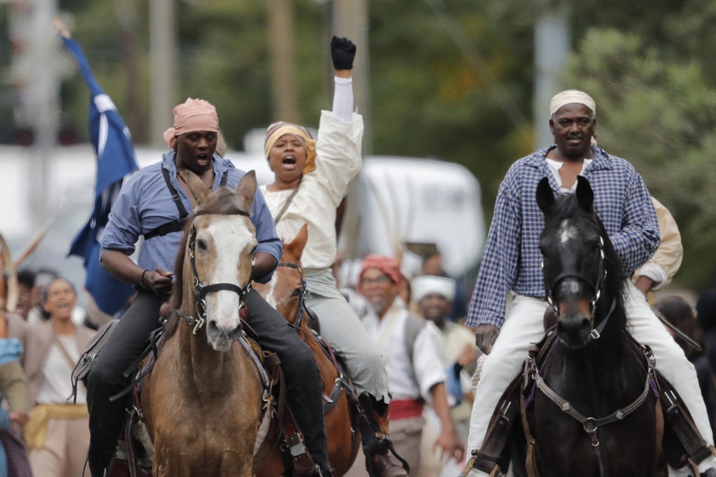 Volunteers participate in a reenactment of what is thought to be the largest slave rebellion in U.S. history in LaPlace, La., on Friday, Nov. 8, 2019. Gerald Herbert/AP