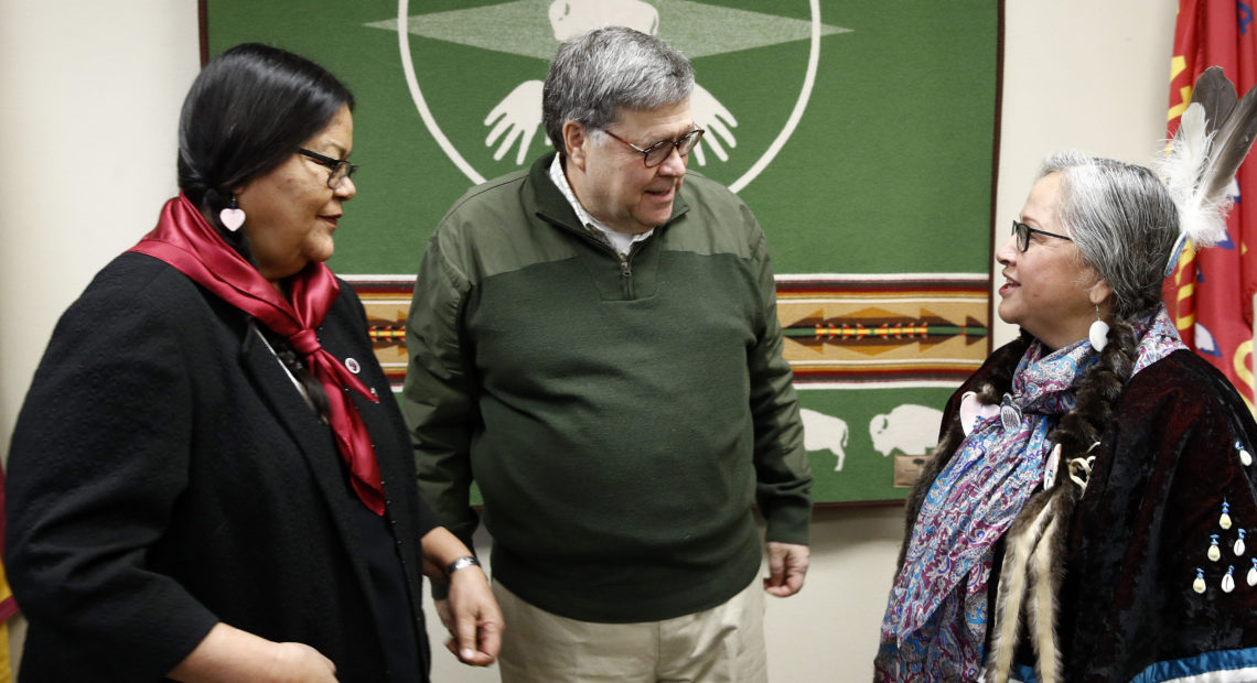 Attorney General William Barr speaks with Myrna DuMontier (left) and Charmel Gillin (right), councilwomen with the Confederated Salish and Kootenai Tribes on Friday on the Flathead Reservation in Pablo, Mont. CREDIT: Patrick Semansky/AP