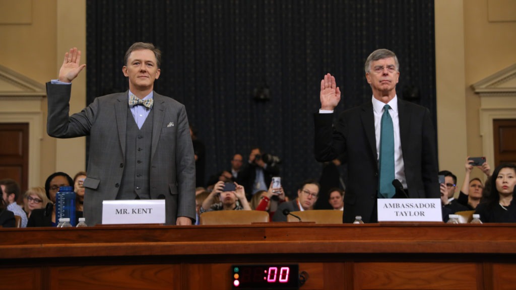 Deputy Assistant Secretary for European and Eurasian Affairs George Kent (left) and top U.S. diplomat in Ukraine William Taylor are sworn in before testifying before the House Intelligence Committee on Capitol Hill on Wednesday. CREDIT: Chip Somodevilla/Getty Images