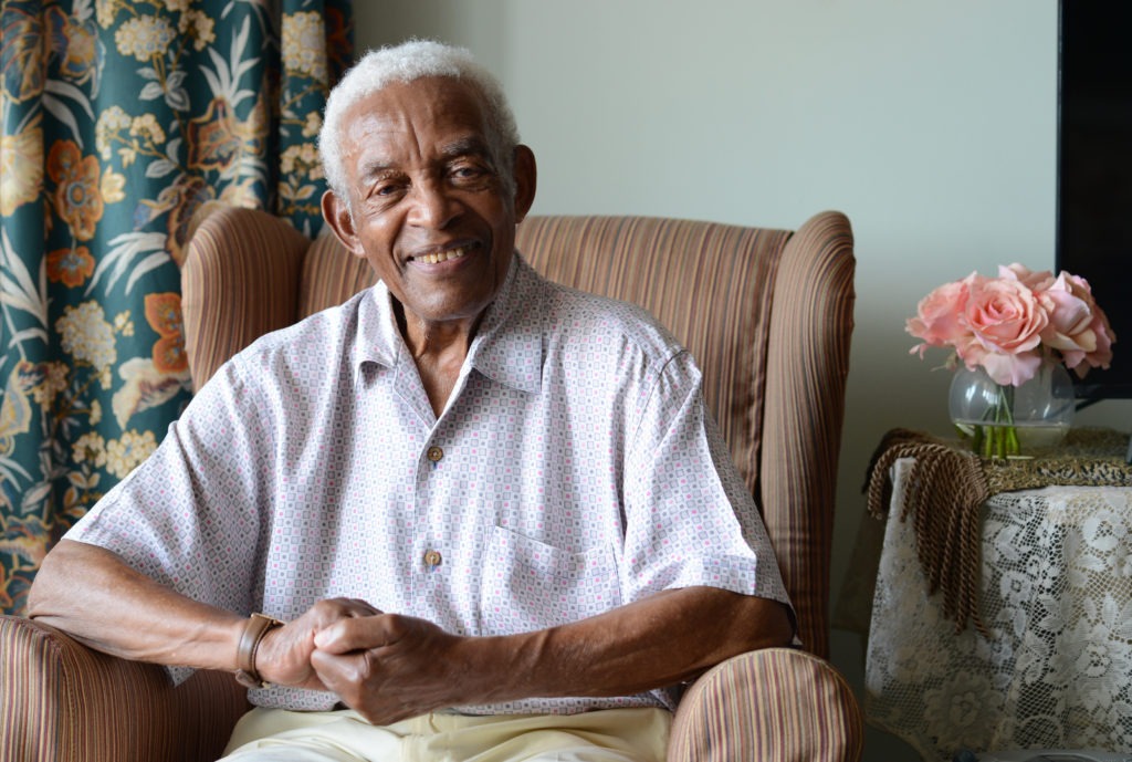 Irving Burgie at his home in Queens in 2017. Burgie, who rewrote the lyrics to the traditional Jamaican song "Day-O," died Friday at the age of 95. CREDIT: Susan Watts/NY Daily News via Getty Images