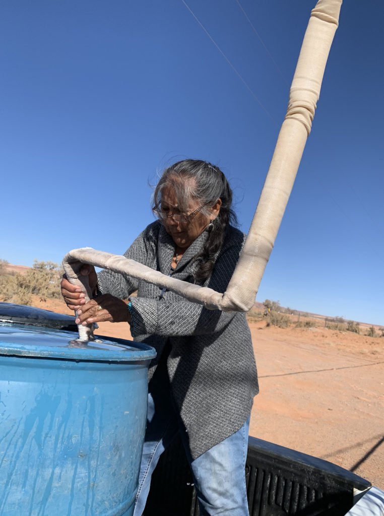 Darlene Yazzie, a retired community health worker, says hauling water, firewood and trash, as well as using an outhouse, are just a few of the things that make life hard on the Navajo Nation. CREDIT: Laurel Morales/KJZZ