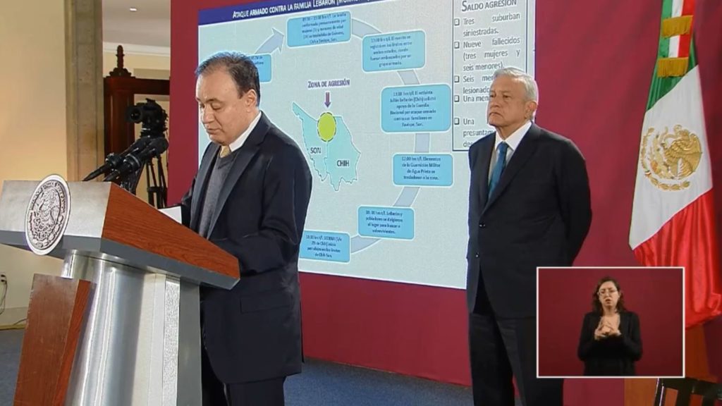 Members of the extended LeBaron family were caught in a brutal attack, Mexican officials say. Here, President Andrés Manuel López Obrador looks on as Security Minister Alfonso Durazo discusses the attack during a news conference Tuesday morning. President Andrés Manuel López Obrador via Facebook