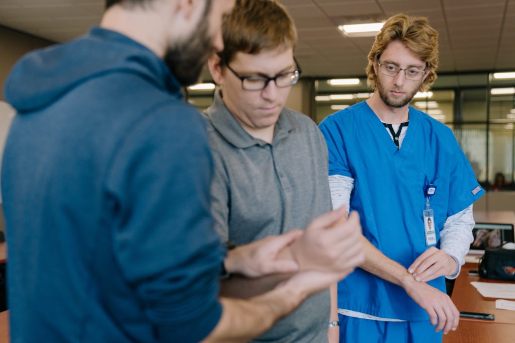 First-year medical student Matthew Braun (right) studies for an anatomy exam with classmates Jeremy Hinton (left) and Jon Hagan. CREDIT: Jovelle Tamayo for NPR
