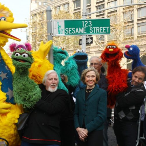 Puppeteer Caroll Spinney (L-R), Sesame Street co-founder and TV producer Joan Ganz Cooney, and Sesame Street cast members pose under a ‘123 Sesame Street’ sign at the ‘Sesame Street’ on Nov. 9, 2009 in New York City. Photo by Astrid Stawiarz/Getty Images