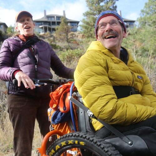 Geoff Babb (seated) hasn't walked since he suffered two brainstem strokes 14 years ago. That prompted him to focus on helping people with serious disabilities access trails, and an outdoor lifestyle. CREDIT: Emily Cureton/OPB
