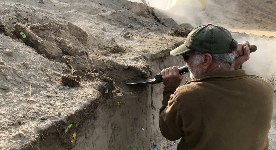 USGS volunteer John Lasher helps dig volcanic ash out of the trench in this dig area southeast of Pasco. CREDIT: Courtney Flatt/NWPB
