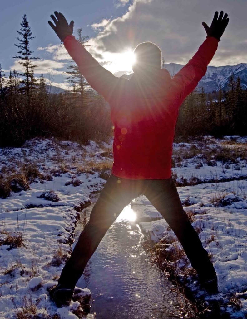 Peter Marbach straddles the headwaters of the Columbia River near Canal Flats. CREDIT: Peter Pochocki Marbach