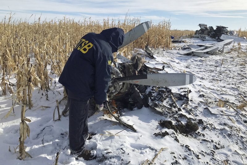 In this Dec. 2, 2019, photo provided by the National Transportation Safety Board, an NTSB investigator begins the examination of the wreckage of the Pilatus PC-12 that crashed in Chamberlain, S.D., on Nov. 30 shortly after departure from Chamberlain Municipal Airport. CREDIT: NTSB via AP