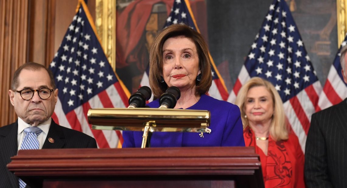 House Speaker Nancy Pelosi and the chairs of investigative committees announces the articles of impeachment against President Trump on Tuesday, Dec. 10. CREDIT: Saul Loeb/AFP via Getty Images