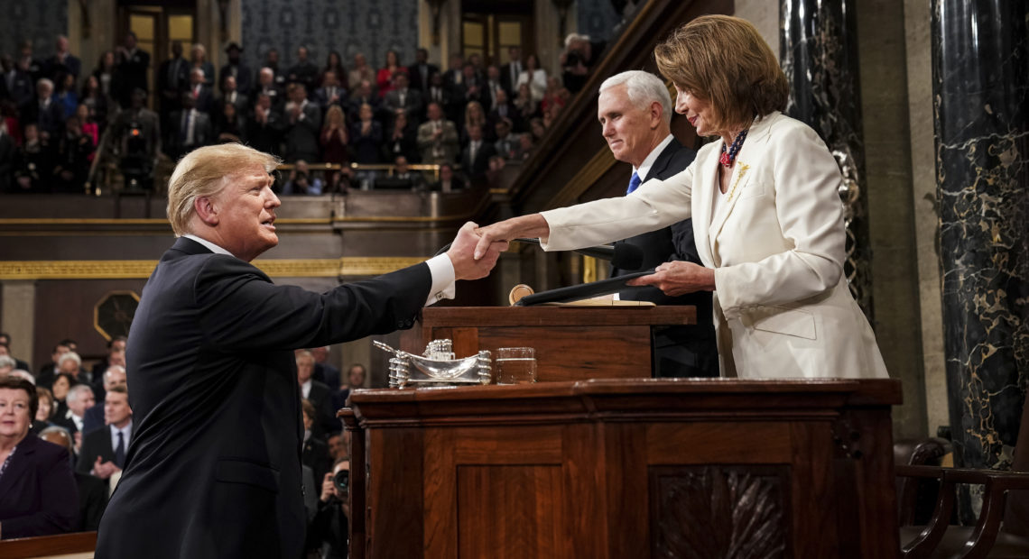 President Trump shakes hands with House Speaker Nancy Pelosi as Vice President Pence looks on in the House chamber before giving his State of the Union address to a joint session of Congress on Feb. 5, 2019. CREDIT: Doug Mills/AP