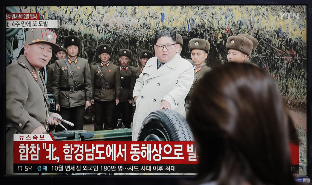 A woman watches a news program showing North Korean leader Kim Jong Un. CREDIT: Lee Jin-man/AP