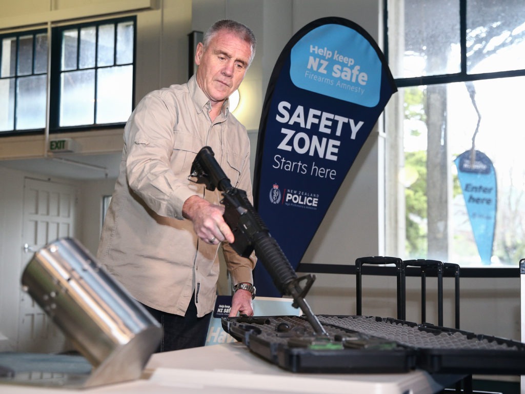 A gun is prepared for use in a bullet trap as part of a demonstration during a firearm buy-back collection event on July 4 in Wellington, New Zealand. CREDIT: Hagen Hopkins/Getty Images