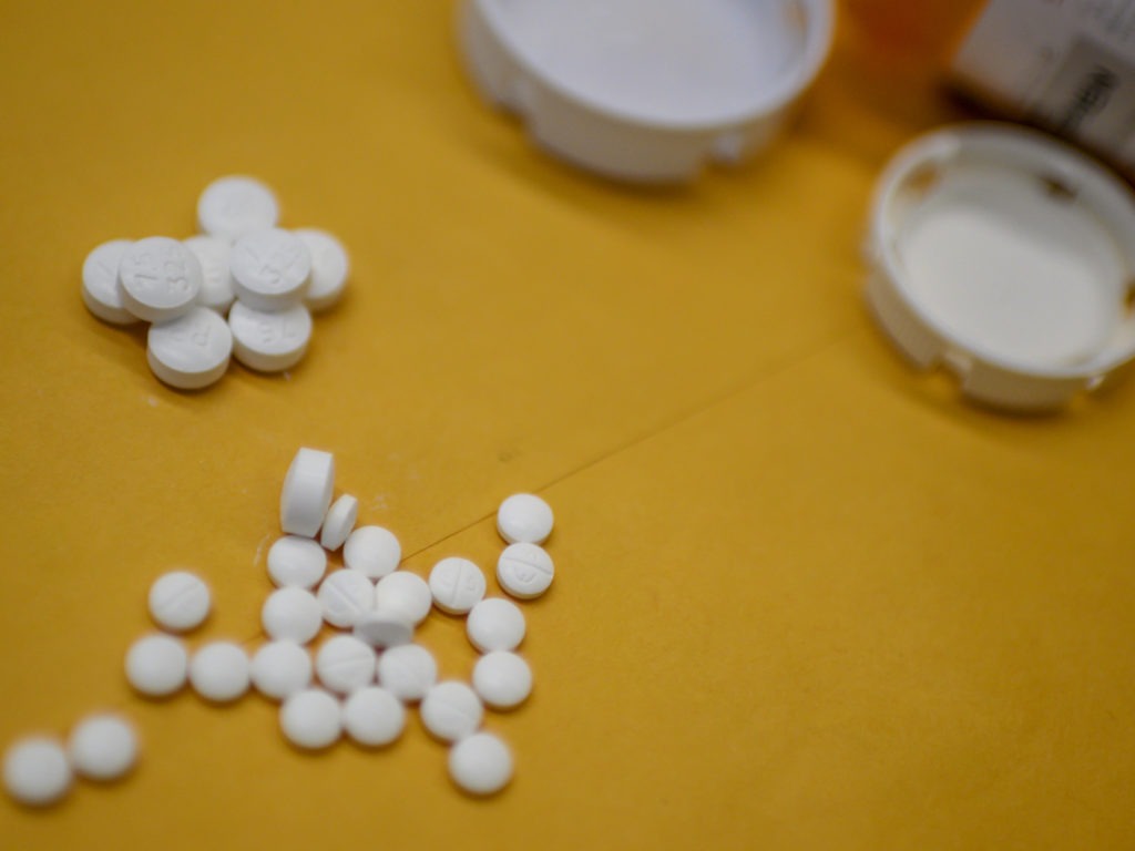 Millions of Americans sank into addiction after using potent opioid painkillers, such as acetaminophen/oxycodone, that companies churned out and doctors freely prescribed over the past two decades. CREDIT: Eric Baradat /AFP via Getty Images