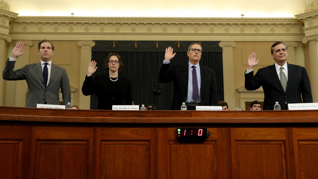 Constitutional scholars Noah Feldman (from left), Pamela Karlan, Michael Gerhardt and Jonathan Turley are sworn in to testify before the House Judiciary Committee Wednesday. Chip Somodevilla/Getty Images