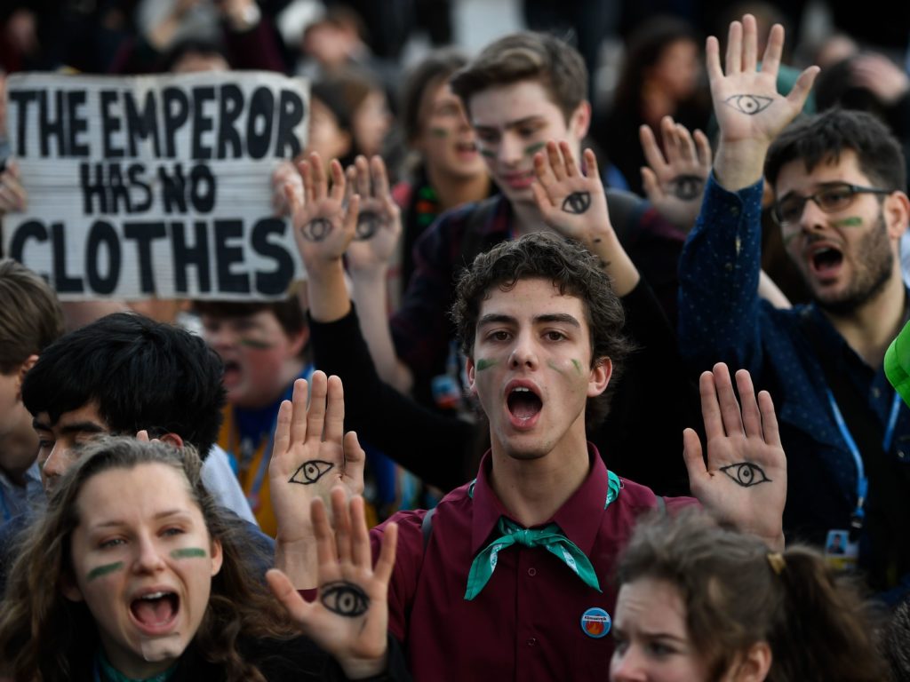 Demonstrators take part in a protest on climate emergency outside the U.N. Climate Change Conference COP25 in Madrid on Friday. CREDIT: Pierre-Philippe Marcou/AFP via Getty Images