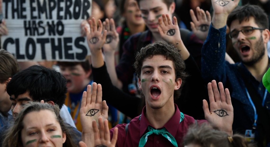 Demonstrators take part in a protest on climate emergency outside the U.N. Climate Change Conference COP25 in Madrid on Friday. CREDIT: Pierre-Philippe Marcou/AFP via Getty Images