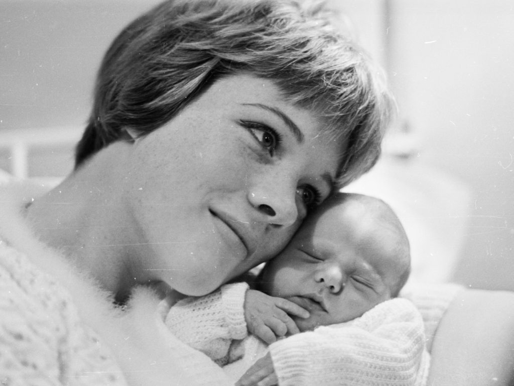 Julie Andrews poses with baby Emma in November 1962. Andrews began filming Mary Poppins a few months after Emma's birth. CREDIT: McCabe/Getty Images