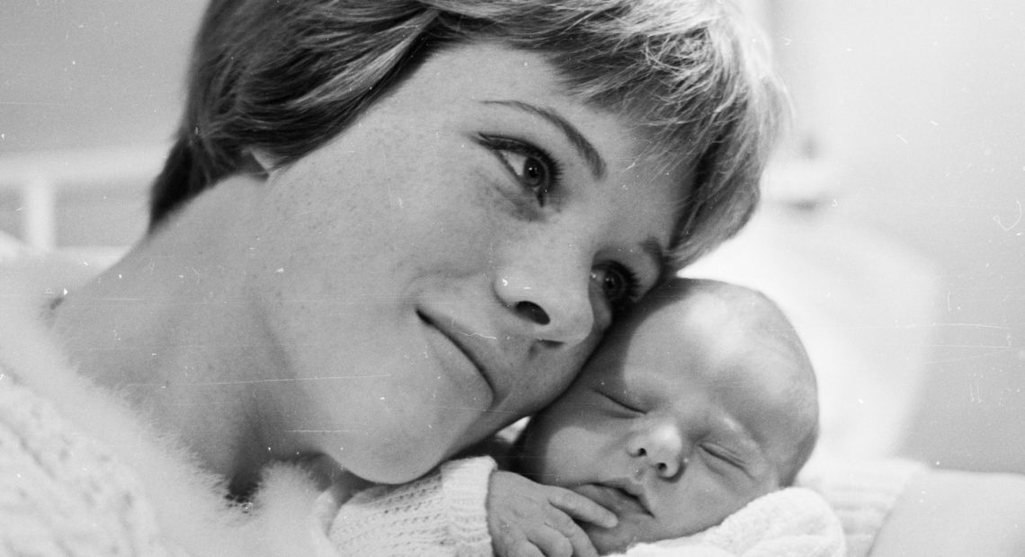 Julie Andrews poses with baby Emma in November 1962. Andrews began filming Mary Poppins a few months after Emma's birth. CREDIT: McCabe/Getty Images