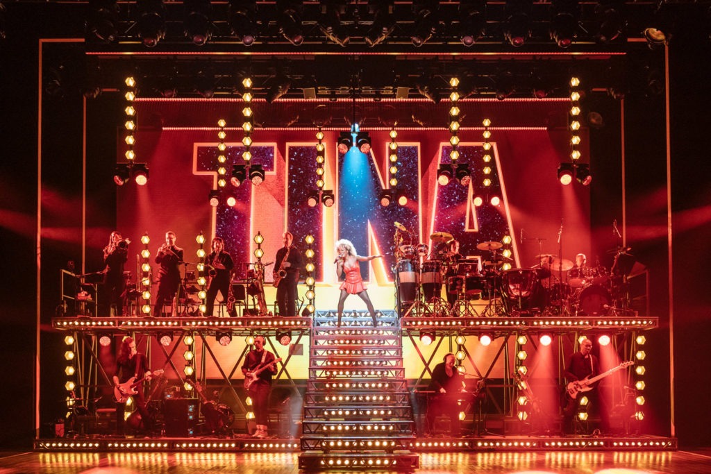 Adrienne Warren, center, stars in Tina: The Tina Turner Musical. CREDIT: Manuel Harlan/Courtesy of Tina: The Tina Turner Musical