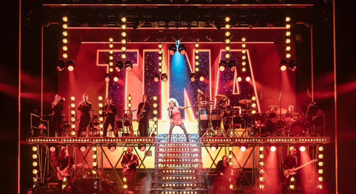 Adrienne Warren, center, stars in Tina: The Tina Turner Musical. CREDIT: Manuel Harlan/Courtesy of Tina: The Tina Turner Musical