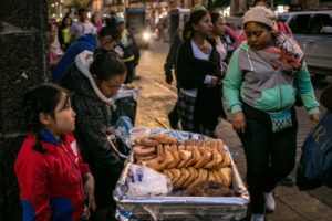 A family sells pastries in Mexico City. As Mexicans' wages have risen, their average daily intake of calories has soared.