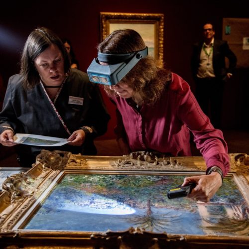 Conservator Felicitas Klein, right, traveled from Germany with Villas at Bordighera, an 1884 painting by Claude Monet. She inspects the painting at the Denver Art Museum, along with senior paintings conservator Pamela Skiles. Kendelyn Ouellette