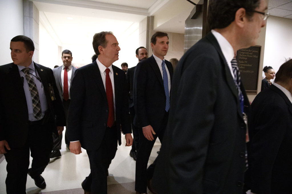 Rep. Adam Schiff (second from left), the lead House Democratic impeachment manager, leaves a news conference on Capitol Hill on Tuesday. CREDIT: Jacquelyn Martin/AP
