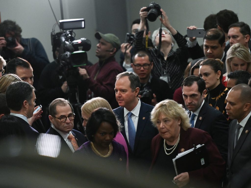 House Manager Adam Schiff (center) leaves after speaking to reporters during the Senate impeachment trial of President Trump Friday. Andrew Caballero-Reynolds/AFP via Getty Images