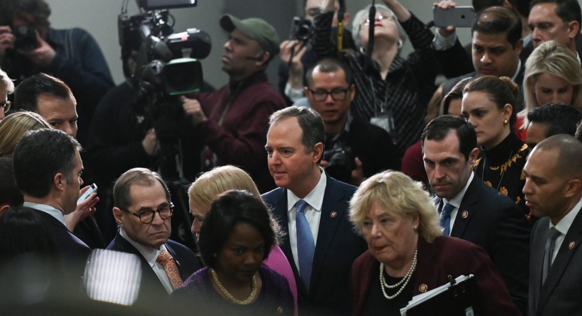House Manager Adam Schiff (center) leaves after speaking to reporters during the Senate impeachment trial of President Trump Friday. Andrew Caballero-Reynolds/AFP via Getty Images