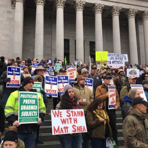 Gun-rights supporters rally on the steps of the Washington state Capitol on Friday. Among the speakers was Republican state Rep. Matt Shea who participated in an act of domestic terrorism, according to a recent House investigation.