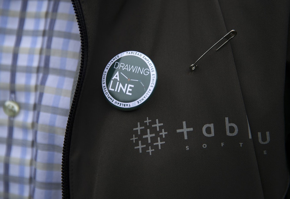 James Baker wears a 'Drawing A Line' pin on Wednesday, December 4, 2019, in Seattle. CREDIT: Megan Farmer/KUOW