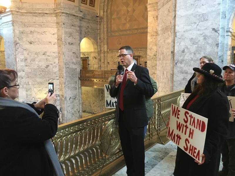 Washington state GOP Rep. Matt Shea records a video on the first day of the legislative session while a small group of supporters gather around him. CREDIT: Austin Jenkins/N3