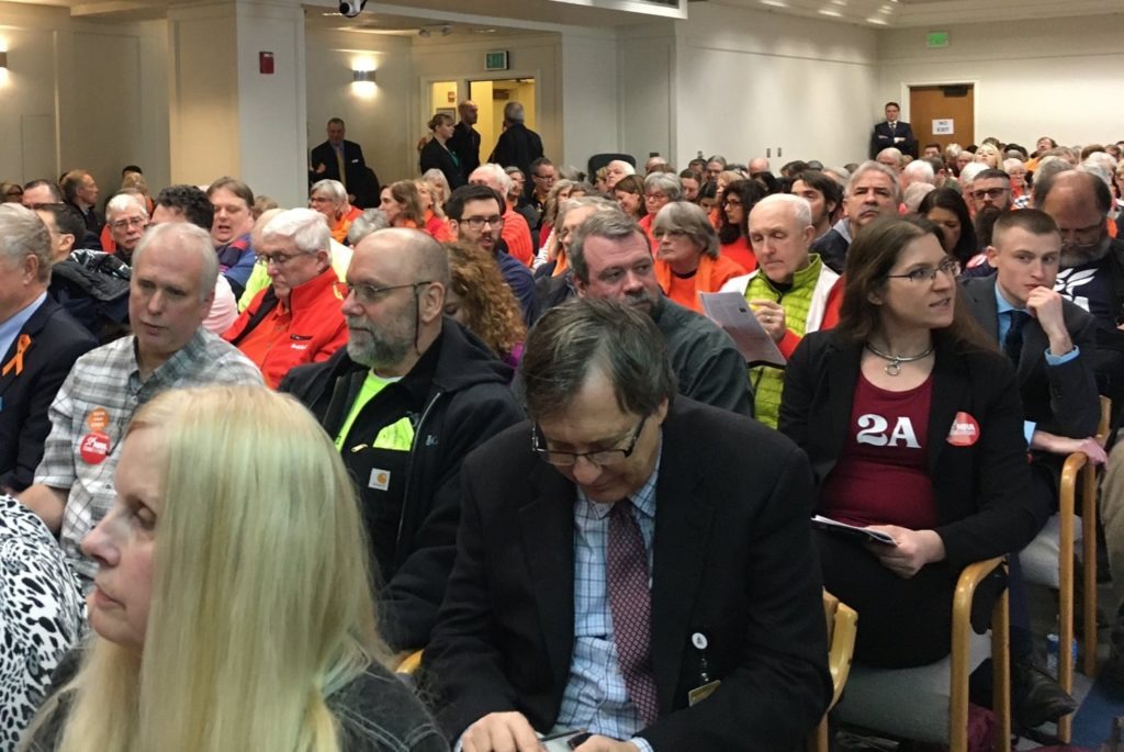 People packed a Washington legislative committee hearing room Monday, Jan. 20, to speak against and in favor of proposed gun safety measures. CREDIT: Austin Jenkins/N3