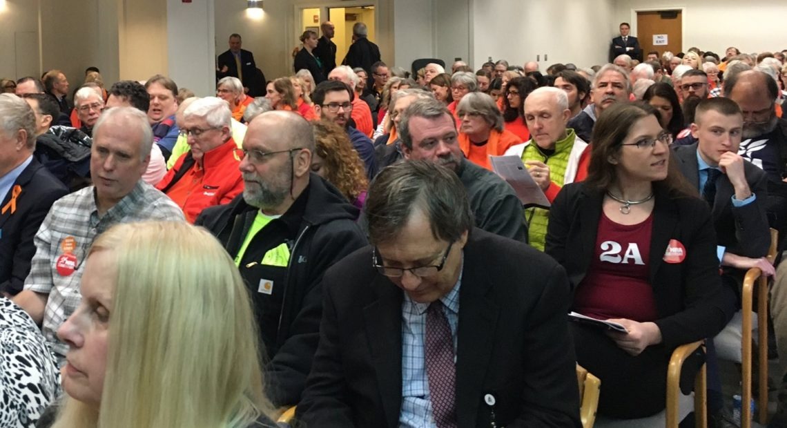 People packed a Washington legislative committee hearing room Monday, Jan. 20, to speak against and in favor of proposed gun safety measures. CREDIT: Austin Jenkins/N3