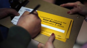 A person signs up to caucus for Democratic presidential candidate and former South Bend, Ind., Mayor Pete Buttigieg following a town hall meeting in Fort Dodge, Iowa