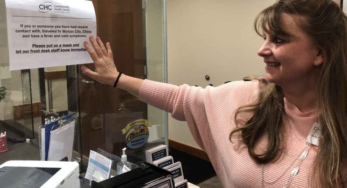 Tove Skaftun, the chief nursing officer for the Community Health Center of Snohomish County, points out a sign warning people who could have been exposed to the new coronavirus from China to identify themselves. CREDIT: Will Stone for NPR