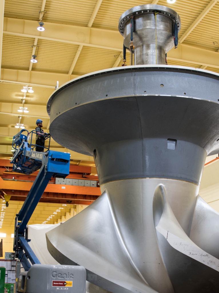 Workers at Ice Harbor Dam on the Snake River inspect a new turbine prior to installation. CREDIT: U.S. Army Corps of Engineers