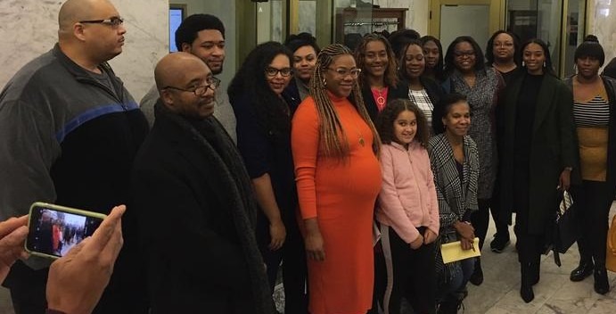 uppporters of a bill to ban race-based hair discrimination pose for a photo following a public hearing in Olympia on Tuesday, Jan. 28, 2020. CREDIT: Austin Jenkins/N3