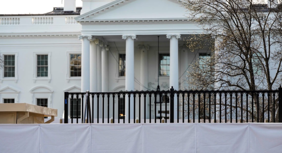 The new fence surrounding the White House is seen behind a screen in Washington, U.S., January 12, 2020. CREDIT: Joshua Roberts/Reuters