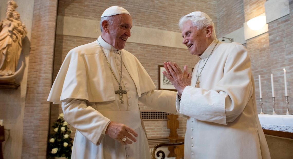 Pope Francis (left) talks with Pope Emeritus Benedict XVI in the former Convent Mater Ecclesiae at the Vatican in 2016, three years after Benedict stunned the Catholic Church by resigning to become pope emeritus. CREDIT: L'Osservatore Romano/AP