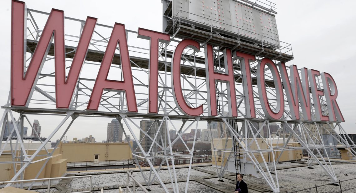 Two women who were sexually abused as children say the Jehovah's Witnesses failed to report their abuser to authorities in Montana and instead expelled him from the congregation as punishment until he repented. Pictured, in 2015, is a sign atop the then-world headquarters of the Jehovah's Witnesses in New York. CREDIT: Seth Wenig/AP