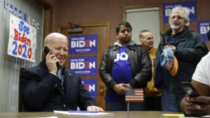 Former Vice President Joe Biden calls potential caucusgoers during a visit to a campaign field office in Waterloo, Iowa, earlier this month